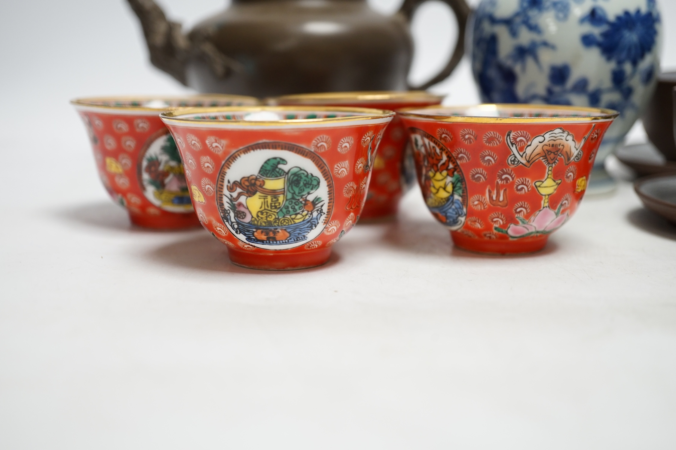 A Chinese blue and white tea caddy, four tea bowls, four cups and saucers and a teapot, largest 17cm high